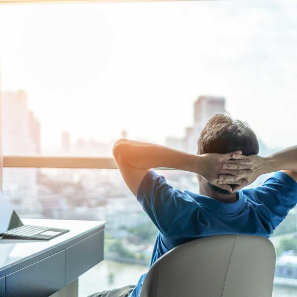 Image of someone taking a break while looking out a window.