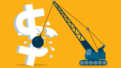 Image of a wrecking ball crashing into a dollar sign.