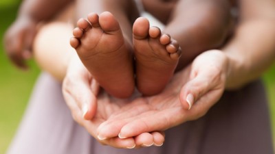 hands holding baby feet
