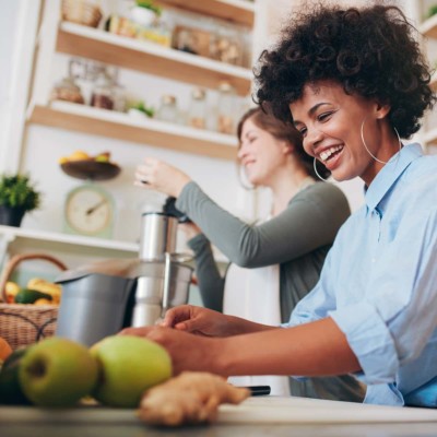 Image of someone making cold pressed green juice.