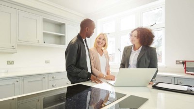 Family talking to their realtor about the value of their home