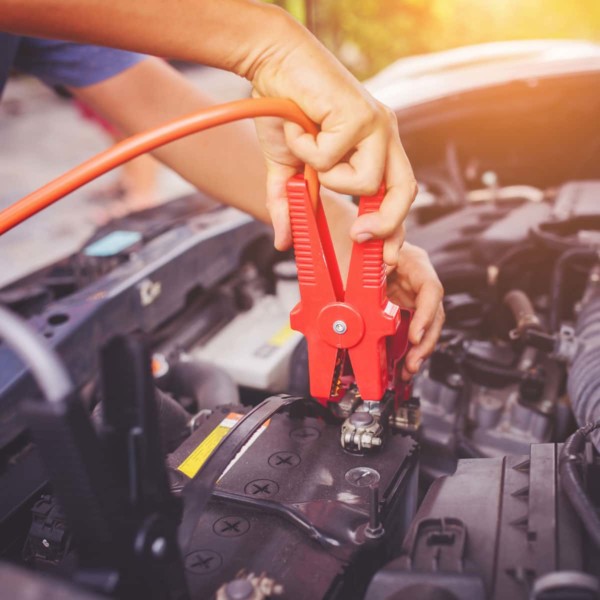 hooking up jumper cable to a car