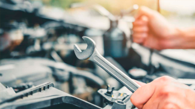 someone doing car maintenance