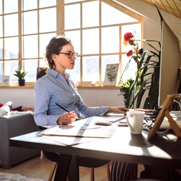 Woman working at desk in the morning