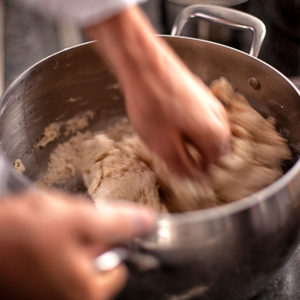 Image someone mixing ingredients in a bowl