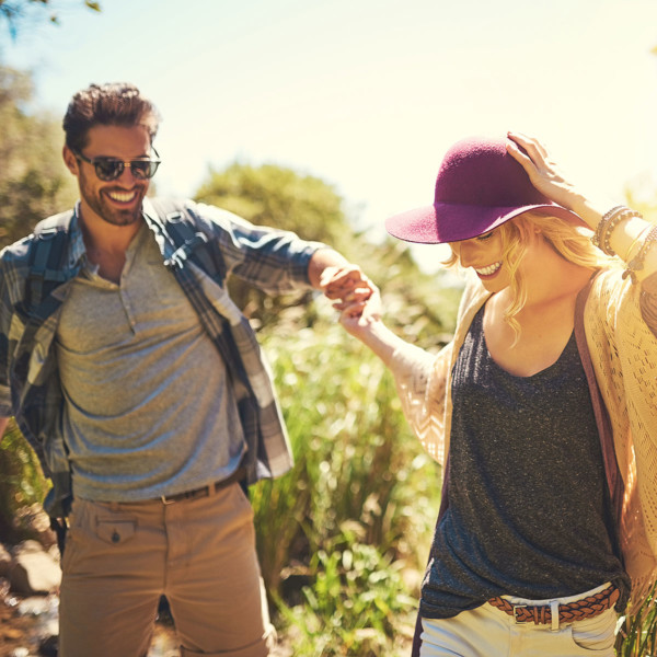 Image of a couple on a date in a field.