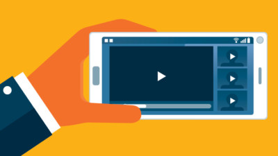 holding a phone and watching online content