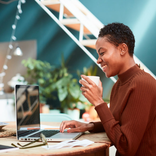 woman using computer to learn how to pay taxes