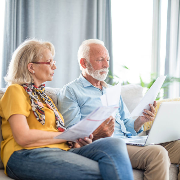 couple reviewing papers in hopes of understanding taxes