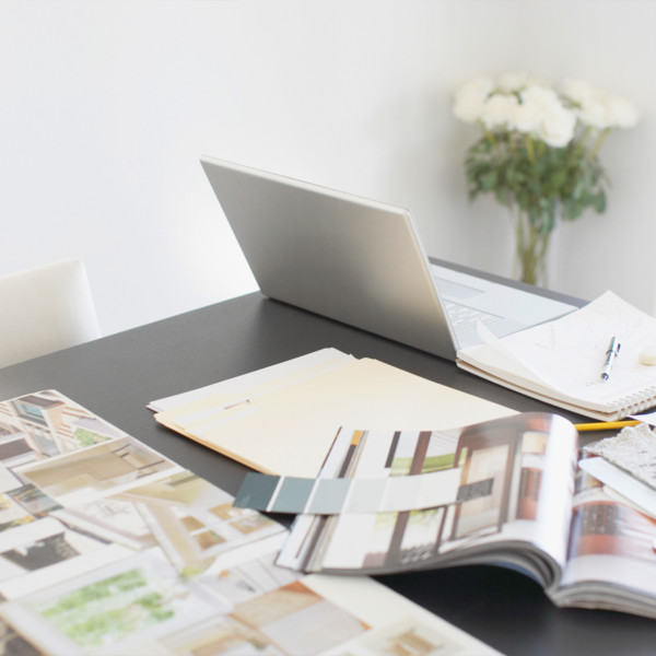 Image of home design books on table with computer
