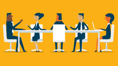 Image of a diverse group of people sitting at a conference table