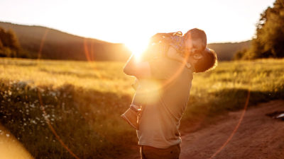 Image of a father holding his son.