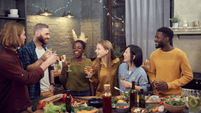 Image of a group of friends sharing drinks together