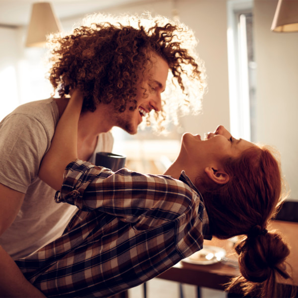 happy couple laughing as they enjoy their relationship