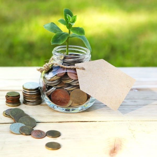 Image of coins in jar to symbolize savings
