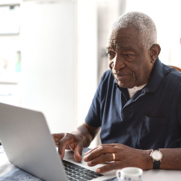 Image of someone on a laptop