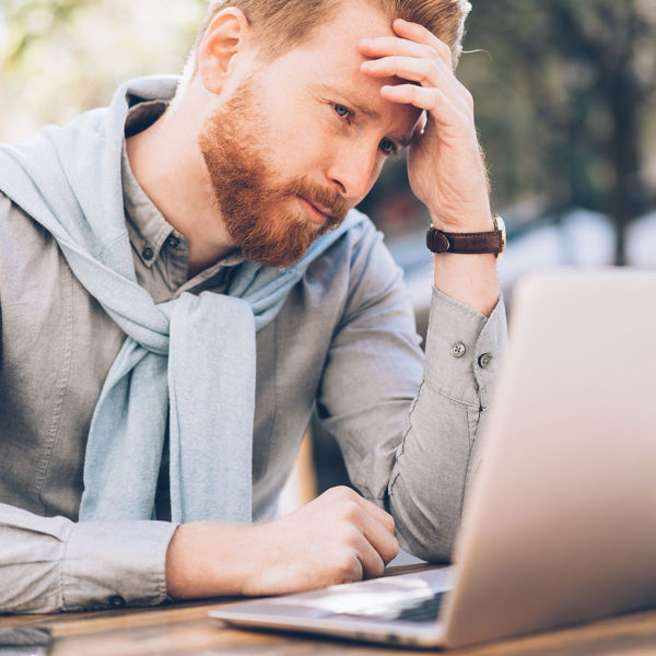Image of someone using their laptop