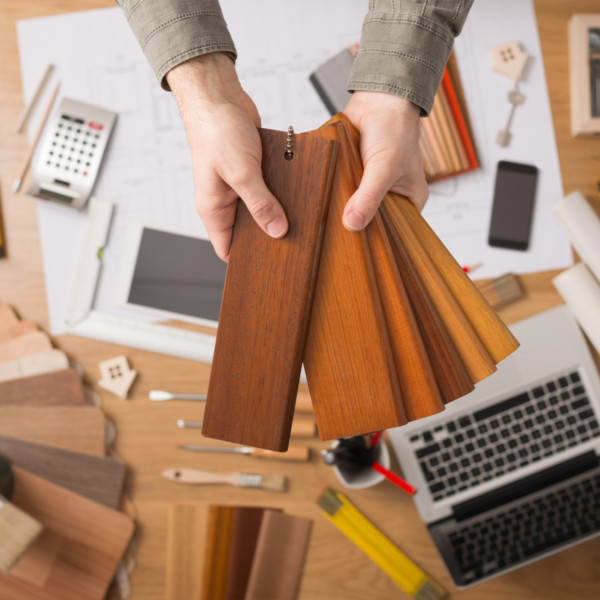 Image of hands holding wood trim selections