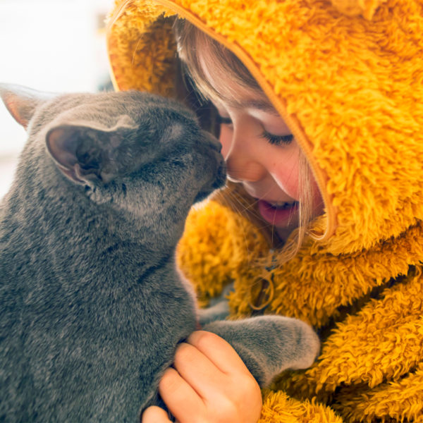 Image of a child with a kitten