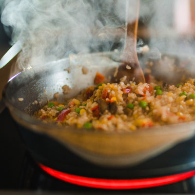 Stirring rice mixture for chicken and rice recipe