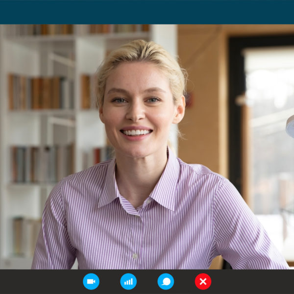 Woman in button up for zoom meeting for work from home