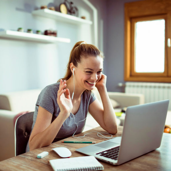 Woman working from home on a zoom call in work from home fashion