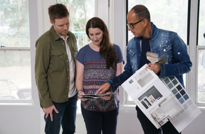 Marcus & couple looking at home samples